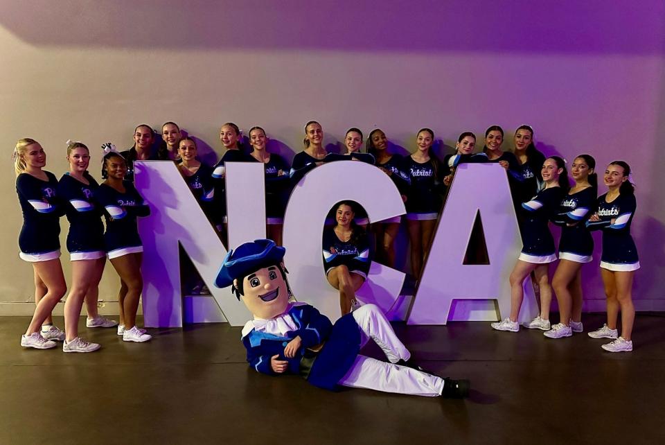 The John Jay cheerleading team poses after taking fifth place in its division at the National Cheerleaders Association High School Nationals tournament in Dallas on Jan. 21, 2023.