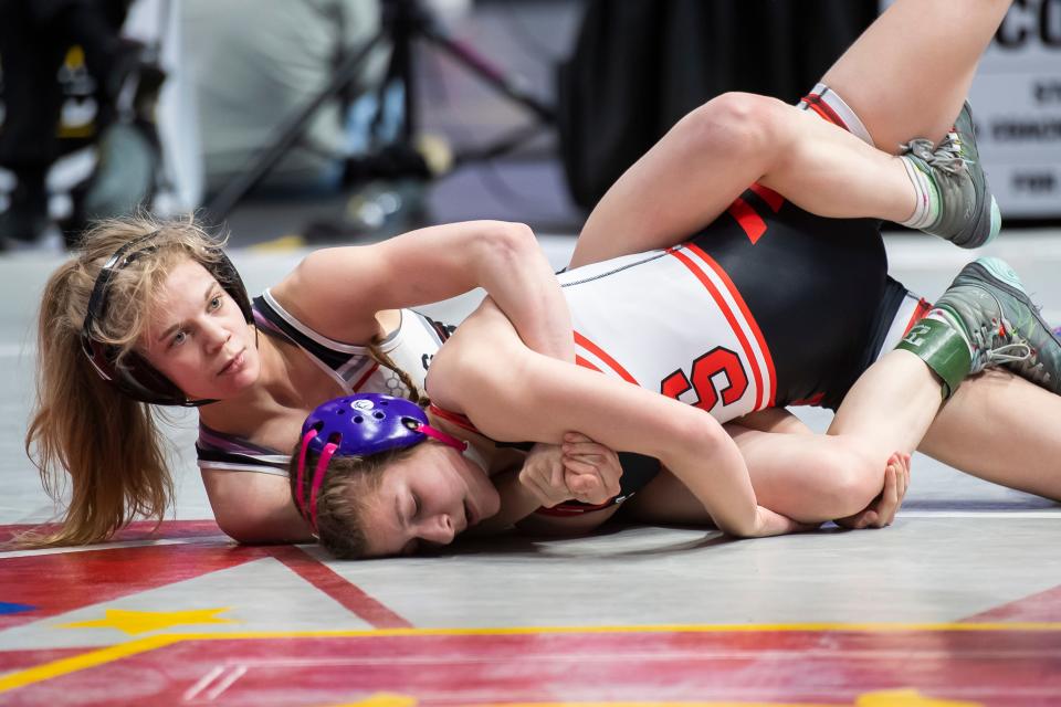 South Western's Natalie Handy (left) works to put Souderton's Emily Sarr in danger during the 106-pound 7th place bout at the PIAA Girls' Wrestling Championships at the Giant Center on March 9, 2024, in Hershey. Handy won by fall at 2:54