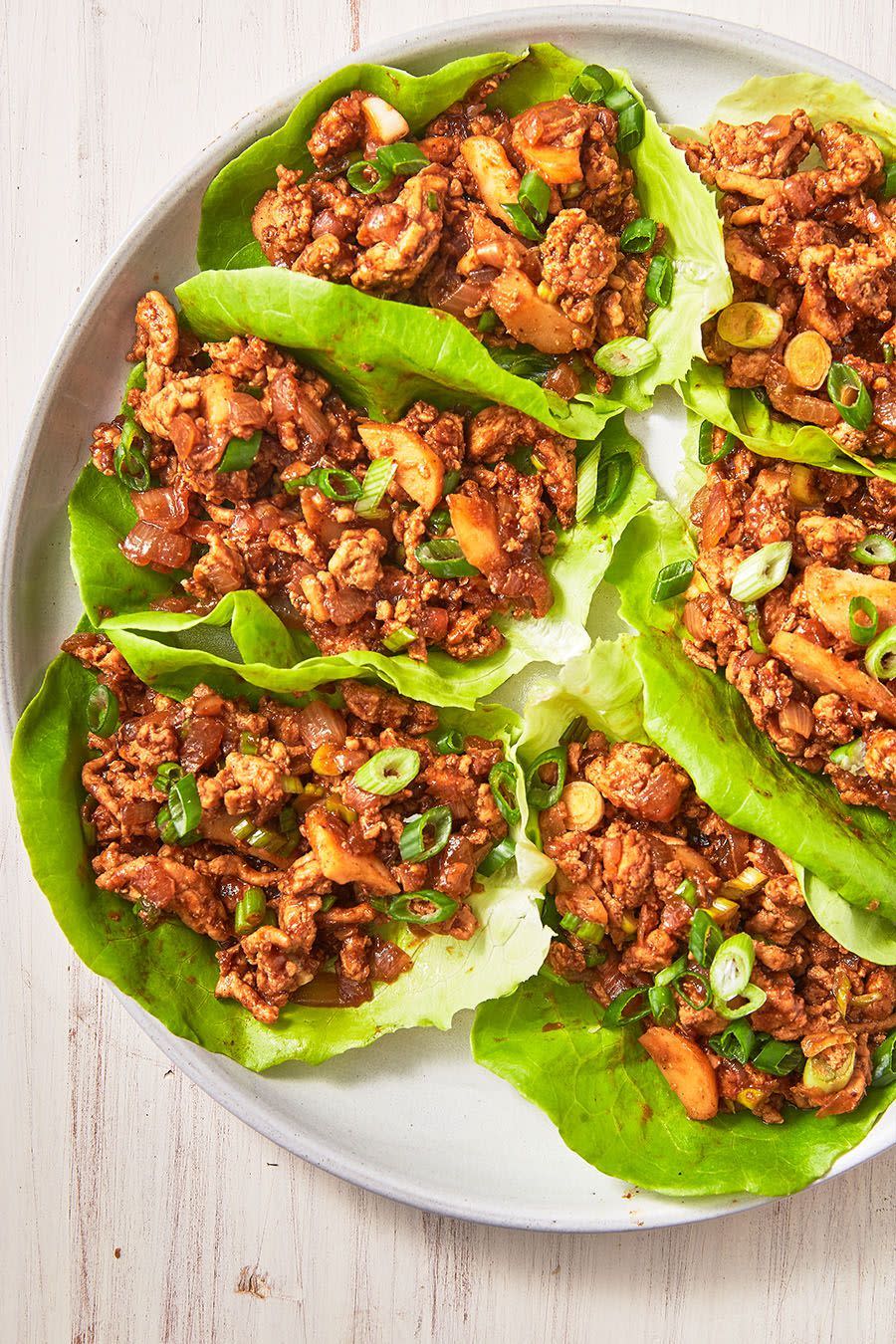 <p>The sauce for these chicken lettuce wraps is extremely addicting. The sriracha adds a little heat, but you can definitely leave it out if you like (although, we like to add a little extra 😉).</p><p>Get the <a href="https://www.delish.com/uk/cooking/recipes/a29891044/asian-lettuce-wraps-recipe/" rel="nofollow noopener" target="_blank" data-ylk="slk:Asian Chicken Lettuce Wraps;elm:context_link;itc:0;sec:content-canvas" class="link ">Asian Chicken Lettuce Wraps</a> recipe.</p>