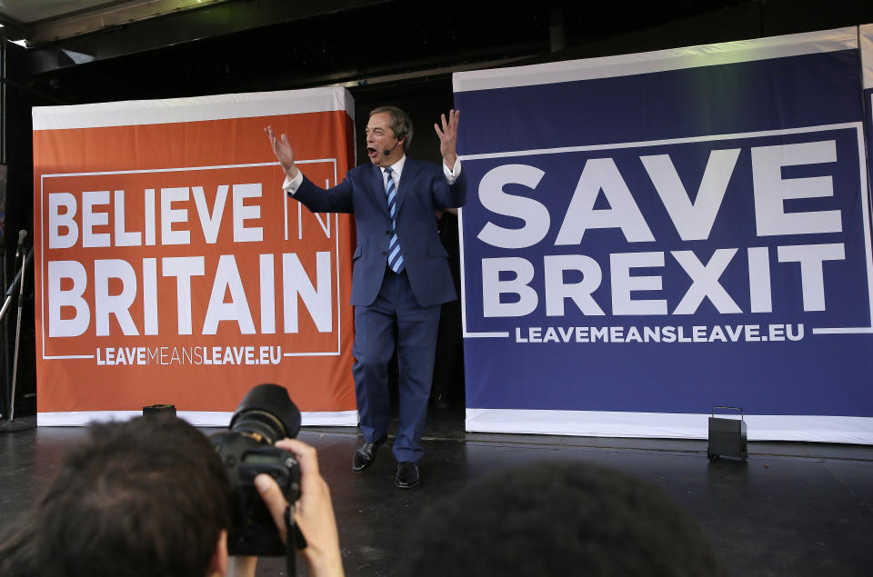 Former UKIP leader Nigel Farage arrives on stage to speak at a rally in Parliament Square after the final leg of the "March to Leave" in London, Friday, March 29, 2019. The protest march which started on March 16 in Sunderland, north east England, finishes on Friday March 29 in Parliament Square, London, on what was the original date for Brexit to happen before the recent extension. (AP Photo/Tim Ireland)
