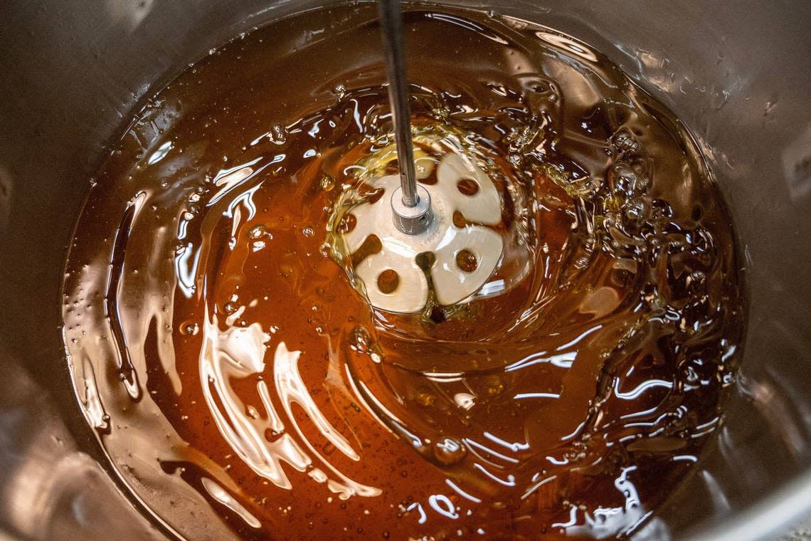 Coconut oil and palm oil are blended to create a batch of Zum Bar soaps in an industrial mixer at Indigo Wild headquarters.