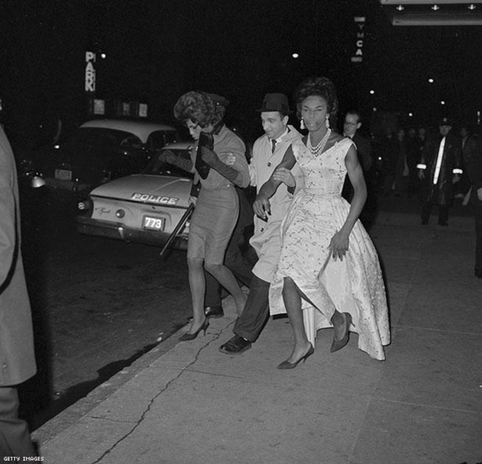 Policeman Arresting Two Men in Drag, 1962, Bettmann