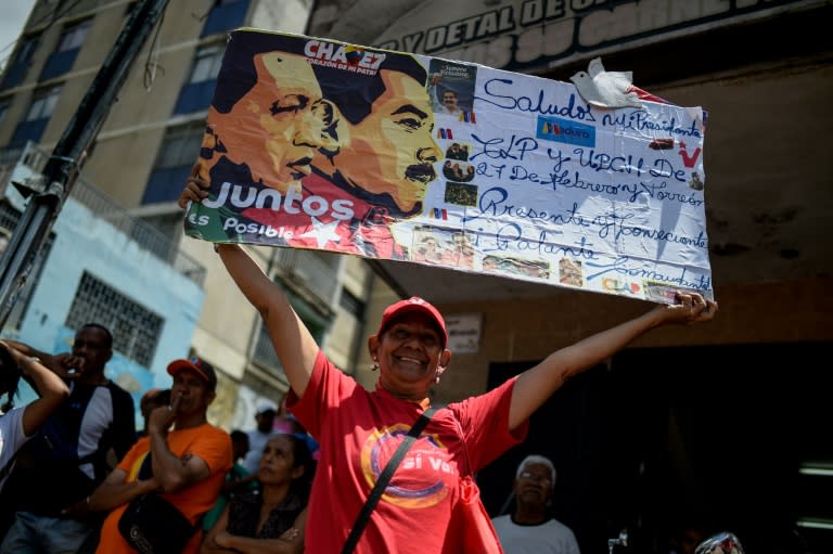 Supporters of Venezuelan President Nicolas Maduro take part in a rally in Caracas on August 13, 2018