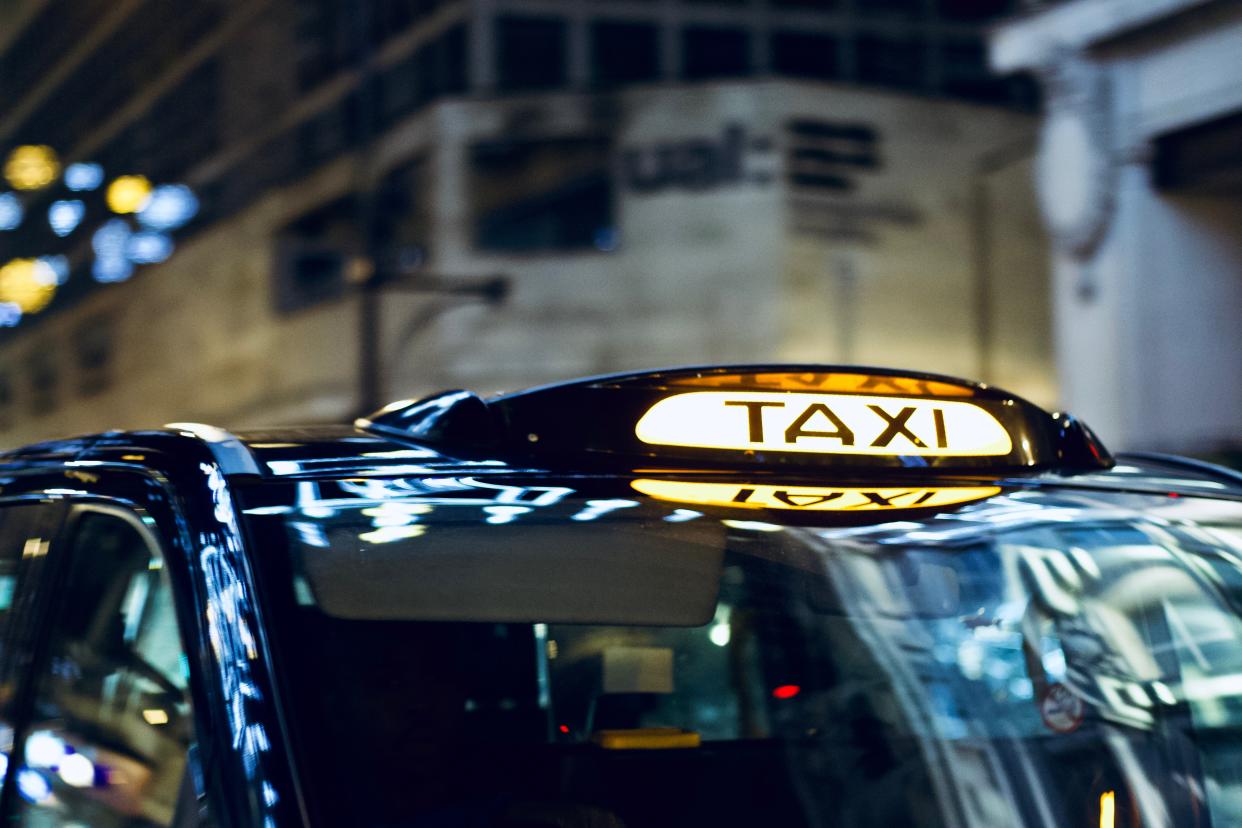 London /England - December 26 2017: Closeup to a London Taxi Sign on Oxford Street