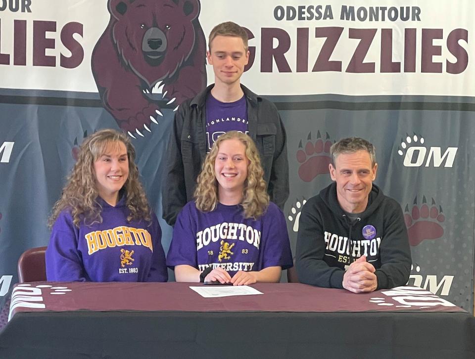 Odessa-Montour's Victoria Brewster, front center, with family members during a signing celebration at O-M on March 9, 2023. Brewster is competing in track & field for Houghton University.