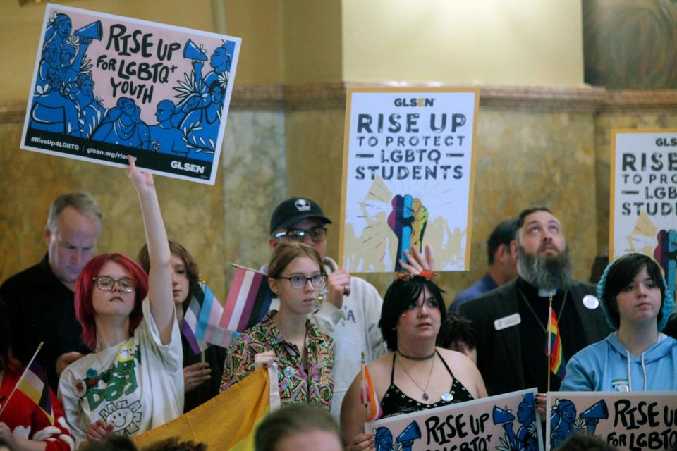 Kansas high school students, family members and advocates rally for transgender rights, Wednesday, Jan. 31, 2024, at the Statehouse in Topeka, Kan. Kansas enacted a law last year that ended legal recognition of transgender identities.