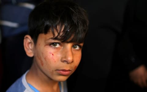 The brother of Palestinian militant Emad Naseer, who was killed in an Israeli air strike - Credit: &nbsp;MOHAMMED SALEM/&nbsp;REUTERS