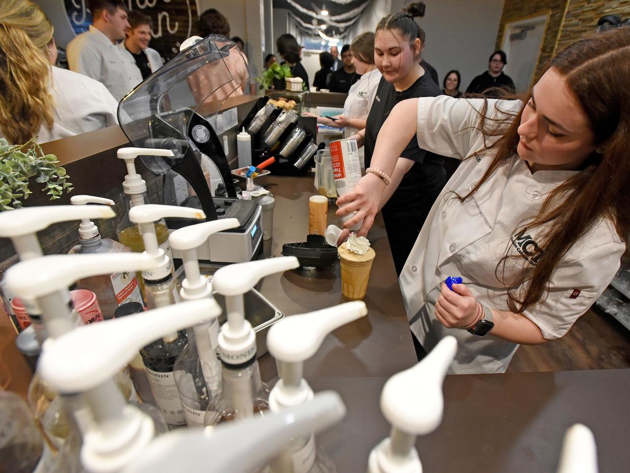 Destiny Smolter prepares a hot beverage Wednesday morning at Common Grounds.