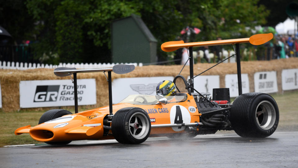 A McLaren M7C-01 race car on track.