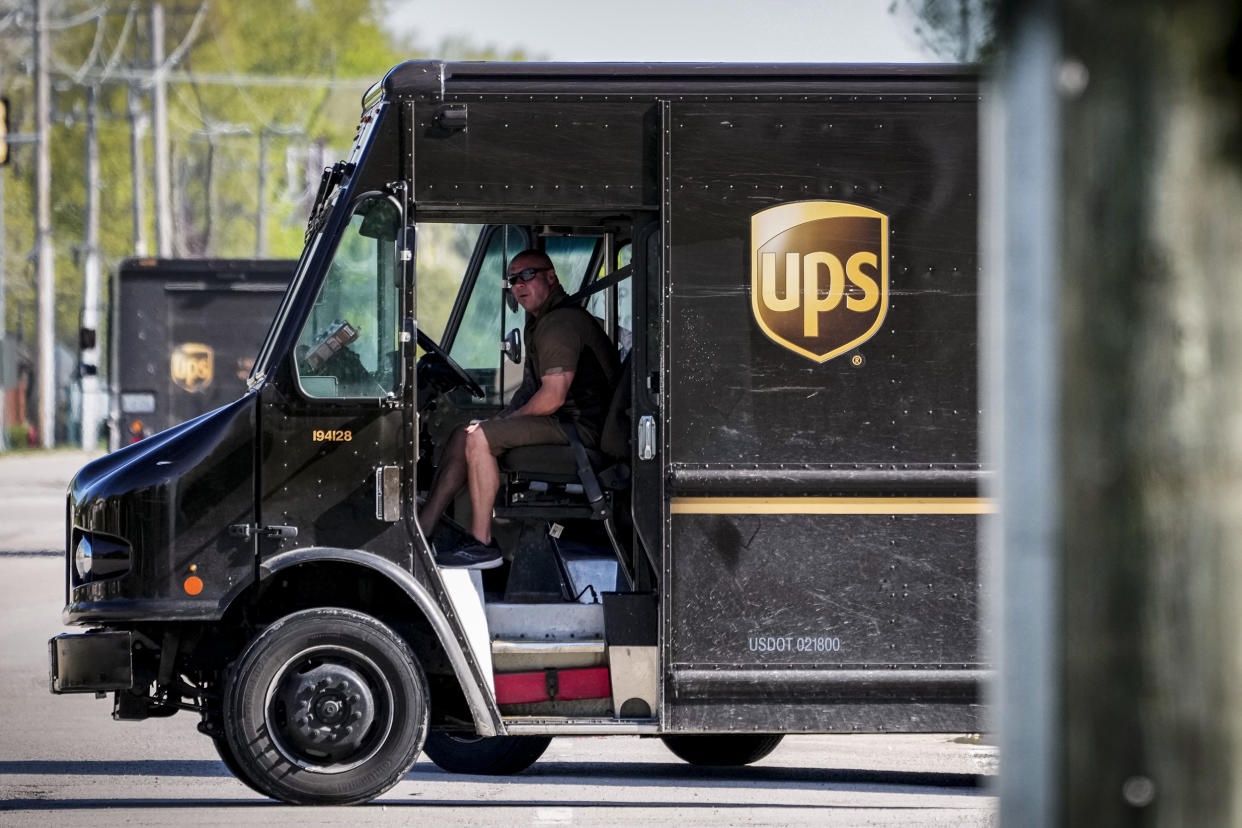 A UPS truck makes deliveries in Northbrook, Ill., on May 10, 2023. (Nam Y. Huh / AP file)