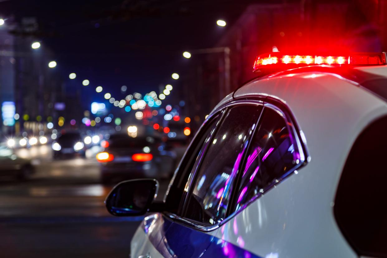 A shot of a police car at night.
