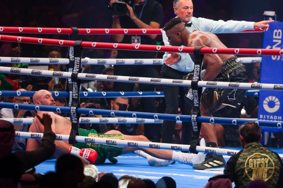 Ngannou mocks Tyson Fury after knocking down the boxer (AFP via Getty Images)