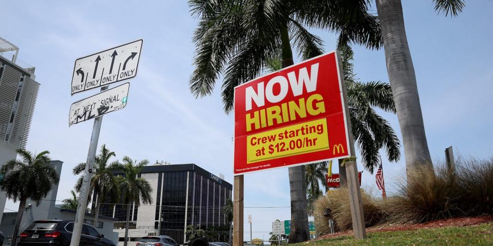 A 'Now Hiring' sign