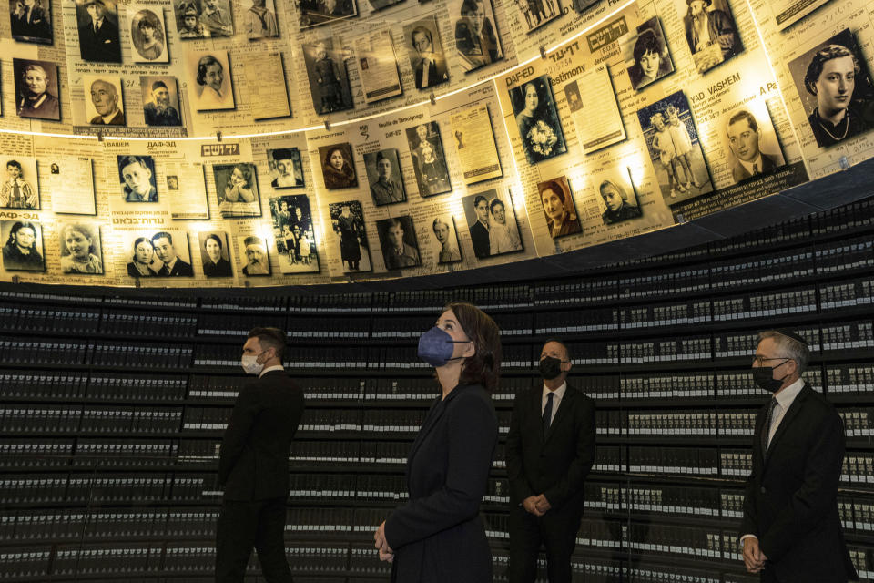 German Foreign Minister Annalena Baerbock visits the Hall of Names at the Yad Vashem Holocaust Memorial in Jerusalem, Thursday, Feb. 10, 2022. (AP Photo/Tsafrir Abayov)