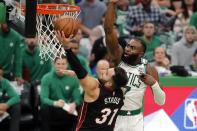 Miami Heat's Max Strus (31) shoots against Boston Celtics' Jaylen Brown (7) during the second half of Game 3 of the NBA basketball Eastern Conference finals playoff series Saturday, May 21, 2022, in Boston. (AP Photo/Michael Dwyer)