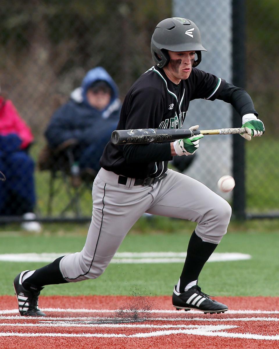 Marshfield's Harry Cooley lays down a bunt that gets him on second base after an overthrow by Plymouth South's Tom Sullivan in the top of the second inning of their game against Plymouth South at Plymouth South High School on Wednesday, April 27, 2022.