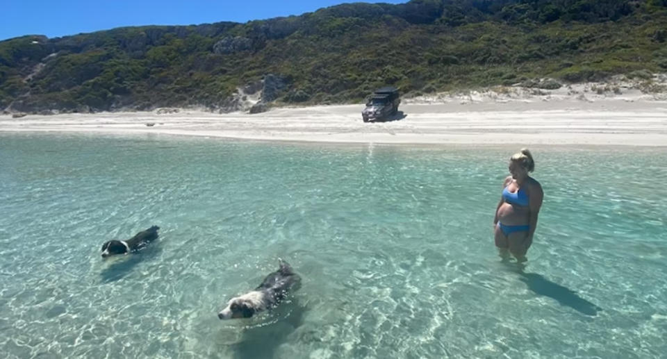 Georgia Crook with their two dogs Mushu and Tilly at 11 Mile beach Esperance, WA. 