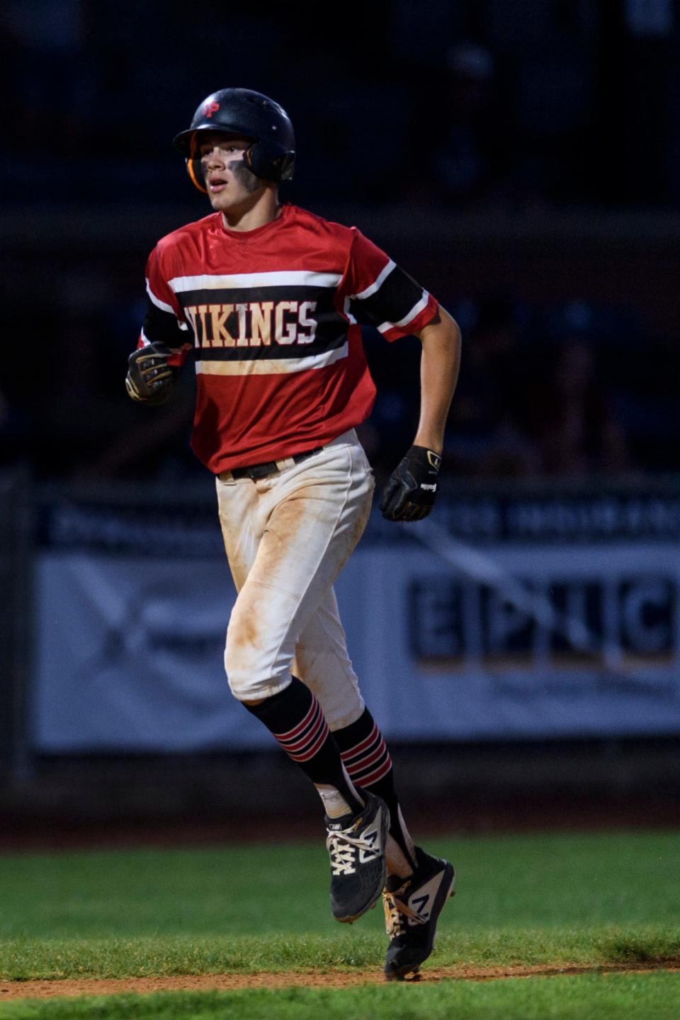 North Posey’s Clay Douglas (18) runs to home plate after making a home run in the seventh inning of the IHSAA 2A baseball regional championship against the Providence Pioneers at Bosse Field in Evansville, Ind., Saturday, June 5, 2021. The Vikings fell 8-6 to the Pioneers. 