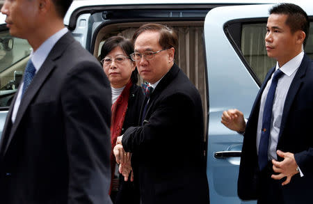 Former Hong Kong Chief Executive Donald Tsang and his wife Selina, accompanied by security guards, arrive at the High Court in Hong Kong, China February 20, 2017. REUTERS/Bobby Yip