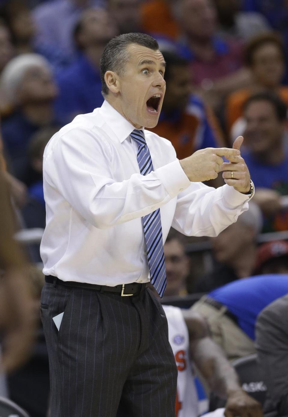 Florida coach Billy Donovan gestures during the second half in a third-round game in the NCAA college basketball tournament against Pittsburgh, Saturday, March 22, 2014, in Orlando, Fla. (AP Photo/John Raoux)