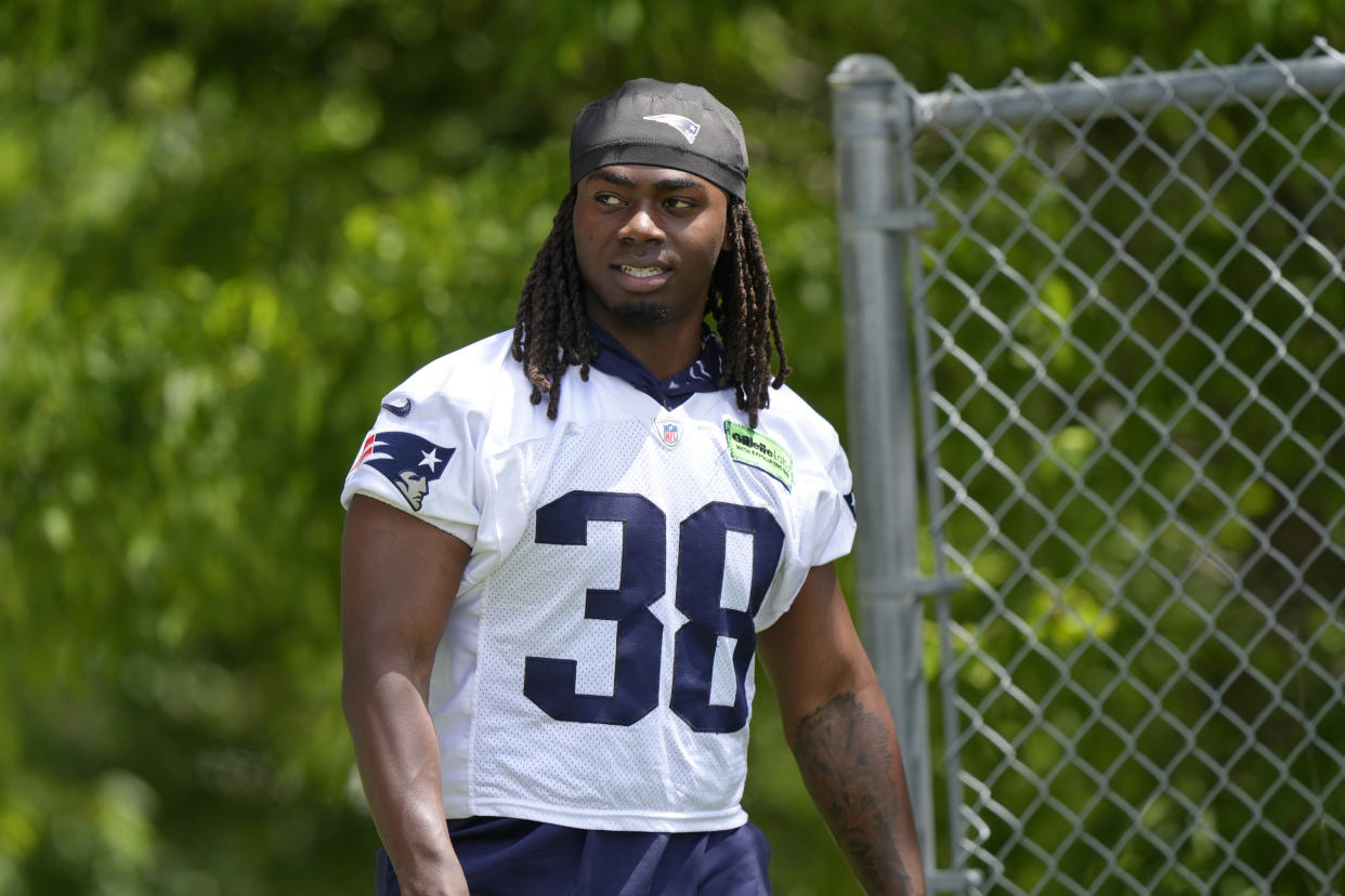 New England Patriots running back Rhamondre Stevenson (38) steps on the field for an NFL football practice, Wednesday, May 29, 2024, in Foxborough, Mass. (AP Photo/Steven Senne)