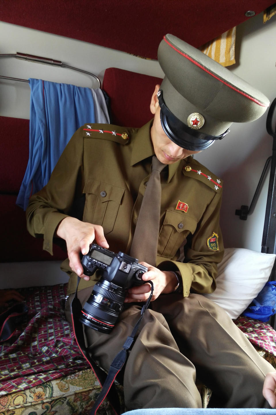 A customs officer checks a passenger's camera&nbsp;on a train from Moscow to Pyongyang at the Tumangang railway station.