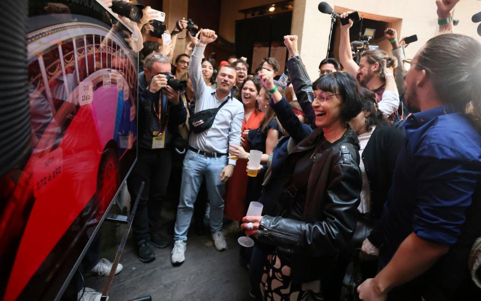 France Unbowed supporters react at the party's HQ