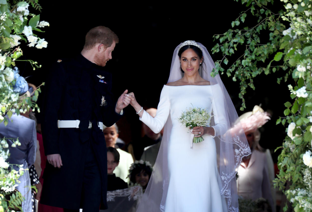 The Duke and Duchess of Sussex on their big day. Embroiderers working on the veil washed their hands every half-hour to keep it spotless before the ceremony. (Photo: Jane Barlow / PA Images / Getty Images)