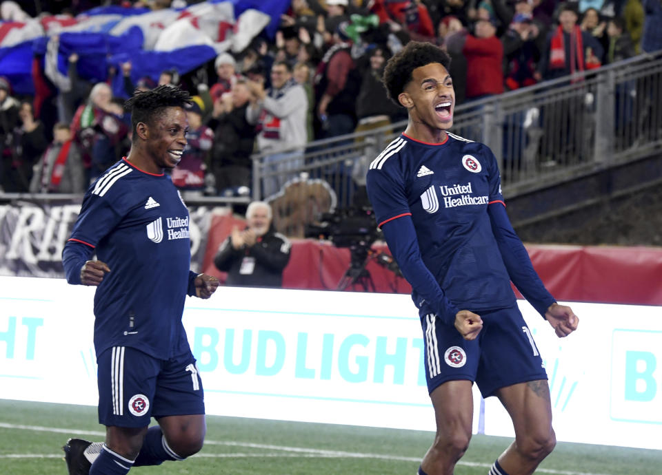 New England Revolution forward Latif Blessing, left, and midfielder Dylan Borrero celebrate after Borrero's goal in the first half of an MLS soccer matchagainst CF Montreal, Saturday, April 8, 2023, in Foxborough, Mass. (AP Photo/Mark Stockwell)