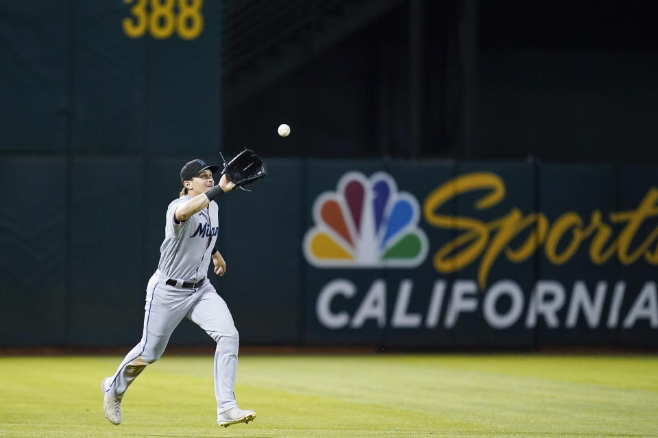 Miami Marlins left fielder JJ Bleday catches a fly out hit by Oakland Athletics' Tony Kemp during the eighth inning of a baseball game in Oakland, Calif., Monday, Aug. 22, 2022. (AP Photo/Godofredo A. Vásquez)