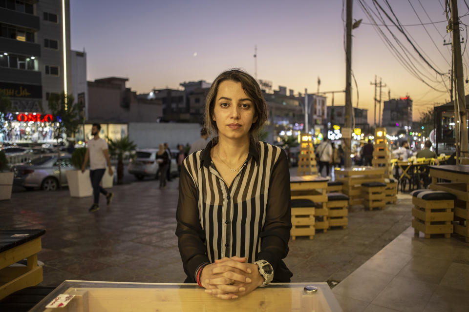 Kawther Fatahi, 33, from Bokan poses for a photograph on Sept. 28, 2022.. She is been living in Iraqi Kurdistan for 10 years. Iran has accused Kurdish opposition groups in exile of orchestrating the wave of protests across the country over the past two weeks. But Kurdish activists say the government is just trying to scapegoat them to distract from the domestic anger fueling the unrest.(AP Photo/Hawre Khalid, Metrography)