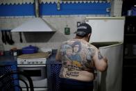 The Wider Image: Argentines celebrate 'eternal love' for Maradona with tattoos