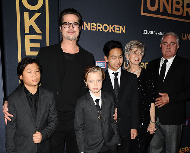 Brad Pitt with Shiloh, Pax and Maddox on the red carpet.