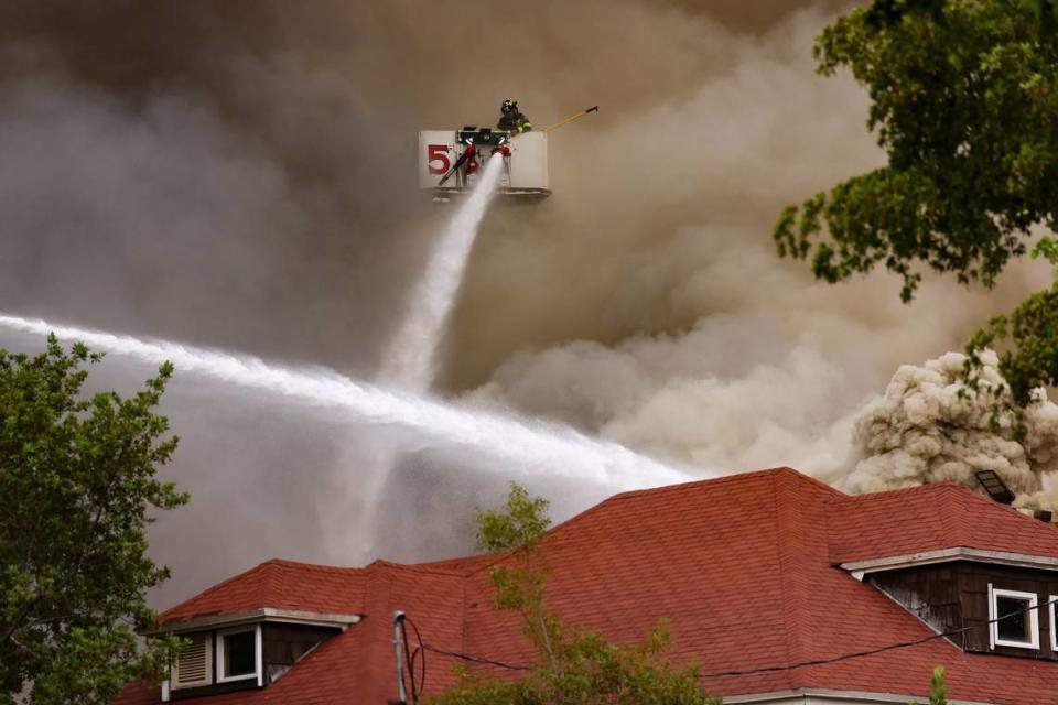 Miami Fire Rescue and Miami police working at the scene of the fire at the Temple Court Apartments, 431 NW Third St.