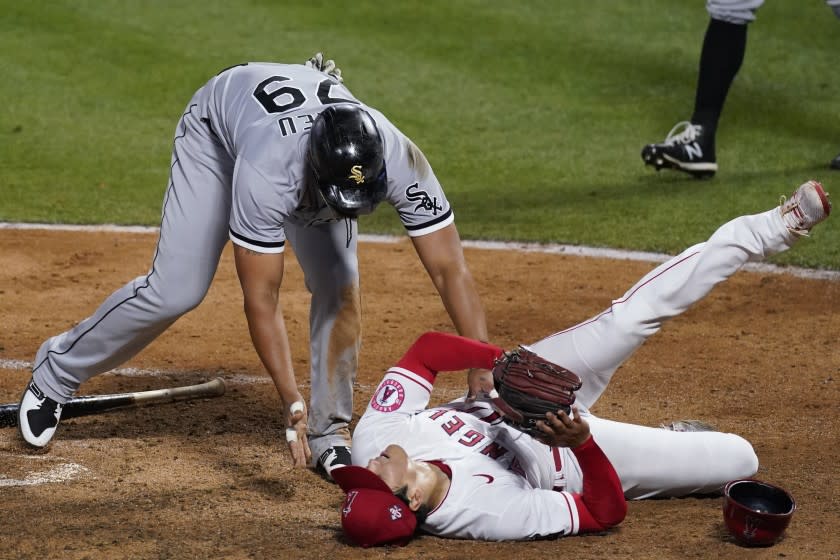 Chicago White Sox's Jose Abreu (79) checks on Los Angeles Angels starting pitcher Shohei Ohtani, right.