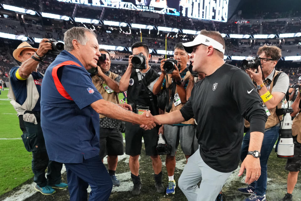 LAS VEGAS, NEVADA - AUGUST 26:  (L-R) Head coach Bill Belichick of the New England Patriots and head coach Josh McDaniels of the Las Vegas Raiders shake hands after their preseason game at Allegiant Stadium on August 26, 2022 in Las Vegas, Nevada. (Photo by Chris Unger/Getty Images)