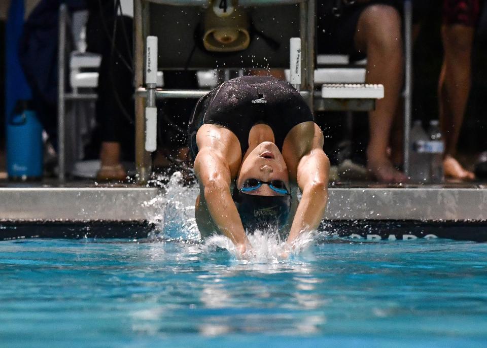 Port St. Lucie's Sarah Evans competes in the 100 Yard Backstroke during the 2021 Florida High School Athletic Association Class 3A Swimming and Diving State Championships on Saturday, Nov. 13, 2021, at Sailfish Splash Waterpark in Stuart. Evans placed first with a time of 53.70.