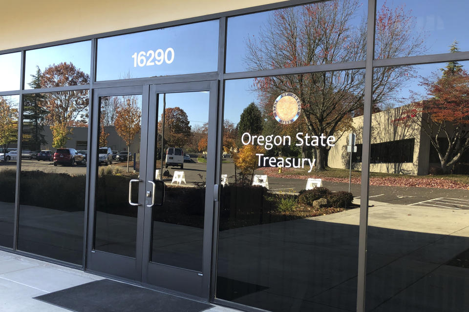 This Oct. 30, 2019, photo shows the Oregon State Treasury office in Tigard, Ore. In the nondescript building in an office park, decisions are made about investments of billions of dollars. Rukaiyah Adams, chairwoman of the Oregon Investment Council, says the Oregon State Treasury should do more to take into account issues such as climate change and human rights when making investment decisions. (AP Photo/Andrew Selsky)