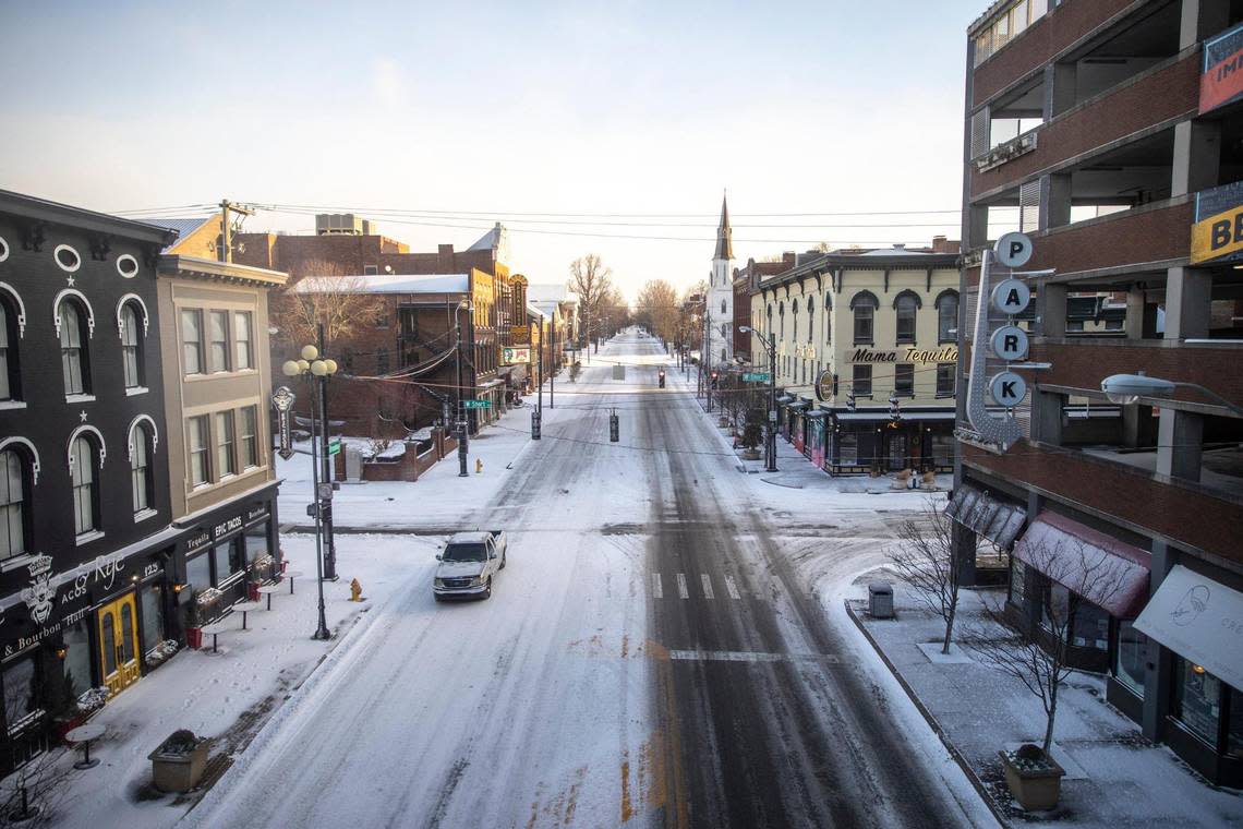 A vehicle drives through downtown Lexington, Ky., on Friday, Dec. 23, 2022.
