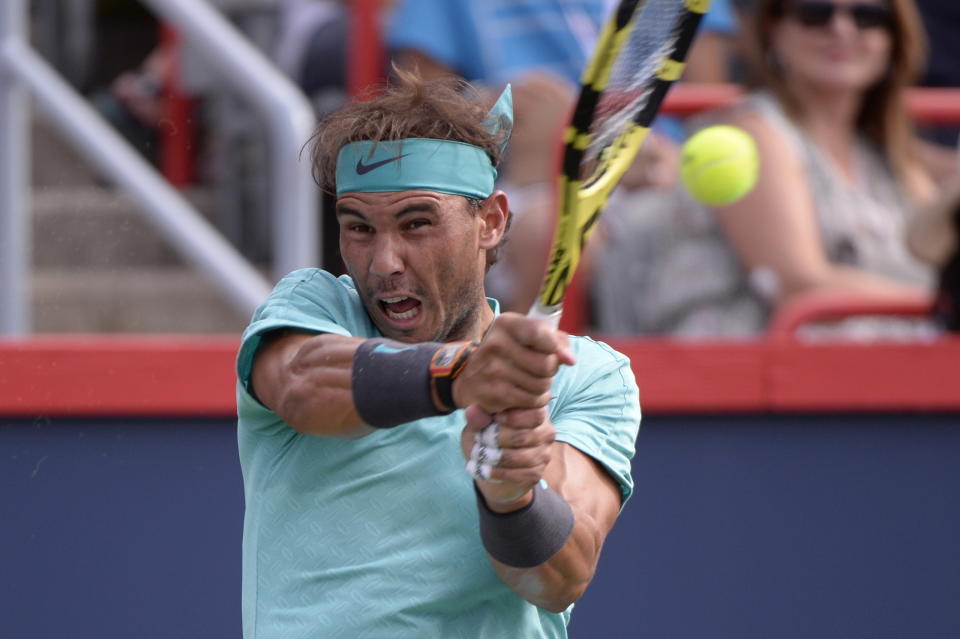 Spain's Rafael Nadal returns to Russia's Daniil Medvedev during the final of the Rogers Cup tennis tournament in Montreal, Sunday, Aug. 11, 2019. (Paul Chiasson/The Canadian Press via AP)