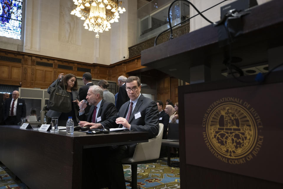 Richard C. Visek, acting legal adviser of the U.S. Department of state, center, waits to address the United Nations' highest court during historic hearings in The Hague, Netherlands, Wednesday, Feb. 21, 2024, into the legality of Israel's 57-year occupation of the West Bank and east Jerusalem, plunging the 15 international judges back into the heart of the decades-long Israeli-Palestinian conflict. Six days of hearings at the International Court of Justice, during which an unprecedented number of countries will participate in proceedings, are scheduled as Israel continues its devastating assault on Gaza. (AP Photo/Peter Dejong)