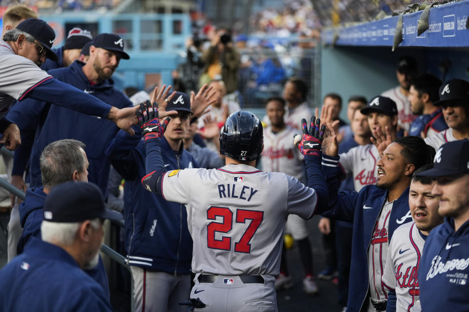 Atlanta Braves' Austin Riley (27) returns to the dugout after hitting a home run during the first inning of a baseball game against the Los Angeles Dodgers in Los Angeles, Friday, May 3, 2024. (AP Photo/Ashley Landis)