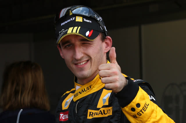 Renault's Robert Kubica gives the thumbs up after qualifying for the second place on the grid.