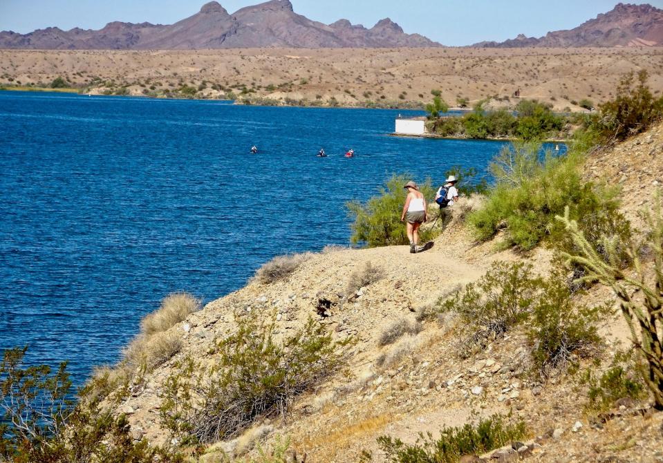 Hikers enjoy a waterside trail in Cattail Cove State Park.