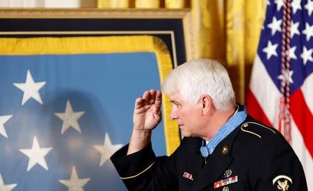 James McCloughan, who served in the U.S. Army during the Vietnam War, salutes family and friends after receiving the Medal of Honor during a ceremony at the White House in Washington, U.S. July 31, 2017. REUTERS/Joshua Roberts