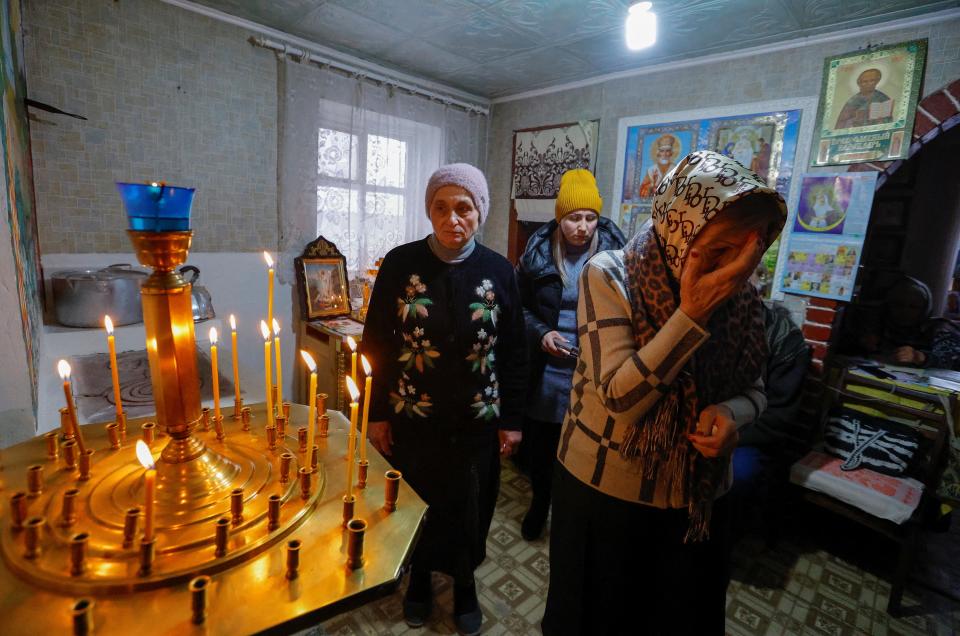 Worshippers lit candles to mark the occasion (Reuters)