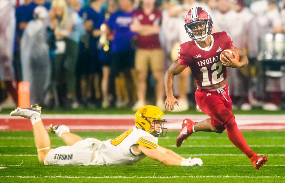 Indiana's Jaylin Lucas (12) leaves Idaho's Sean McCormick (10) grabbing air during the Indiana versus Idaho football game at Memorial Stadium on Saturday, Sept. 10, 2022.