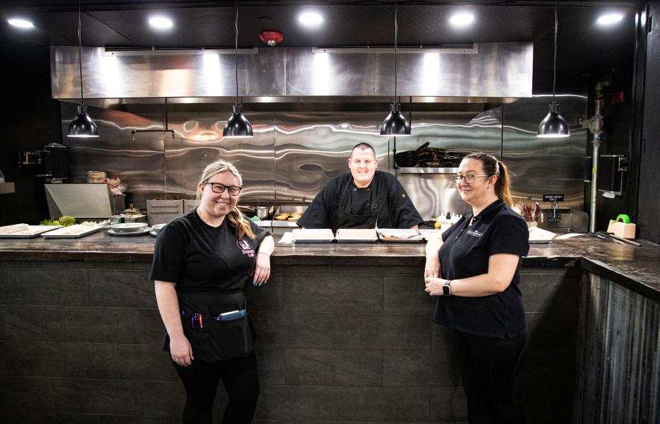 Carl, Carol and Natasha Smith stand for a portrait in The Causeway, a restaurant/bar along Old U.S. 41 in Bonita Springs. March 19, 2024. Carl and Carol are owners. Carl is also the executive chef. Carol is General Manager and Natasha runs the Dessert Lab At The Causeway.