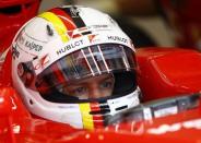 Ferrari Formula One driver Sebastian Vettel of Germany sits in his car in the pit during the first practice session of the Austrian F1 Grand Prix at the Red Bull Ring circuit in Spielberg, Austria, June 19, 2015. REUTERS/Leonhard Foeger