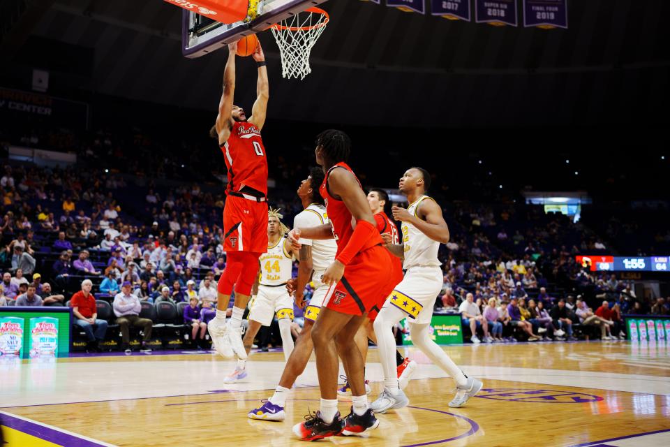 Jan 28, 2023; Baton Rouge, Louisiana, USA; Texas Tech Red Raiders forward Kevin Obanor (0) dunks the ball against the LSU Tigers during the second half at Pete Maravich Assembly Center. Mandatory Credit: Andrew Wevers-USA TODAY Sports ORG XMIT: IMAGN-501926 ORIG FILE ID:  20230128_anw_pl2_083.JPG